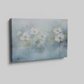 Framed canvas print of serene watercolor flowers with soft blue hues and water reflections