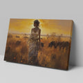 Framed canvas print of a figure in traditional attire at sunset with a savannah wildlife scene