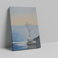 Canvas print of a tranquil ocean view with a blossoming plant in a vase on a ledge