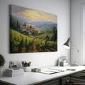 Framed canvas print of a Tuscan vineyard at sunset with warm golden hues and terracotta houses