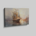 Framed canvas print of a historic sailboat sailing at sunset with golden light reflecting on the water