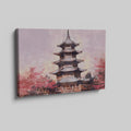 Framed canvas print of a tranquil pagoda with cherry blossoms in soft pastel hues