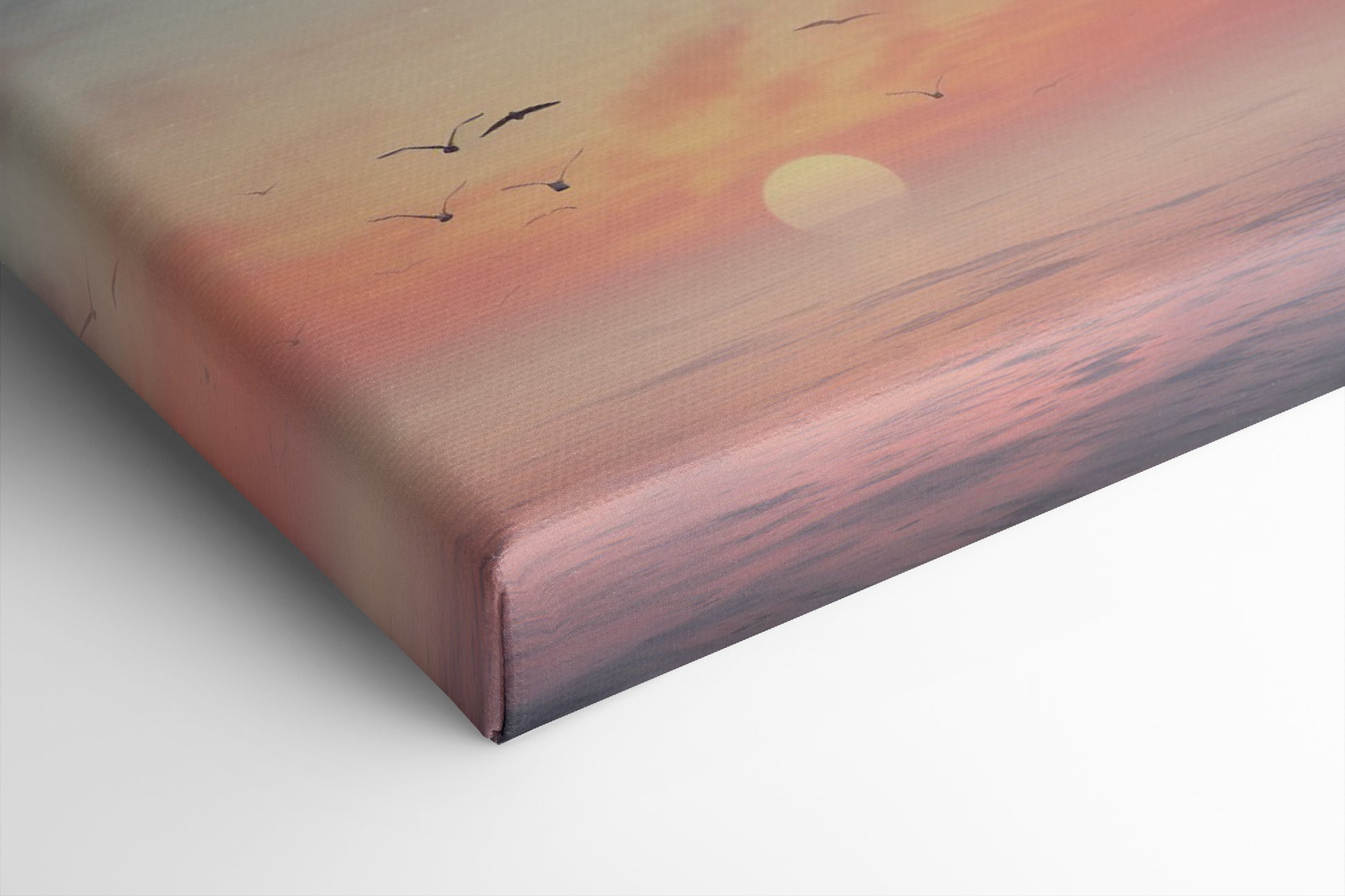 Framed canvas print of a tranquil seascape at sunset with birds and pastel skies