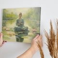 Framed canvas print of a meditative woman in a tranquil lotus pond with soft light and pastel colours