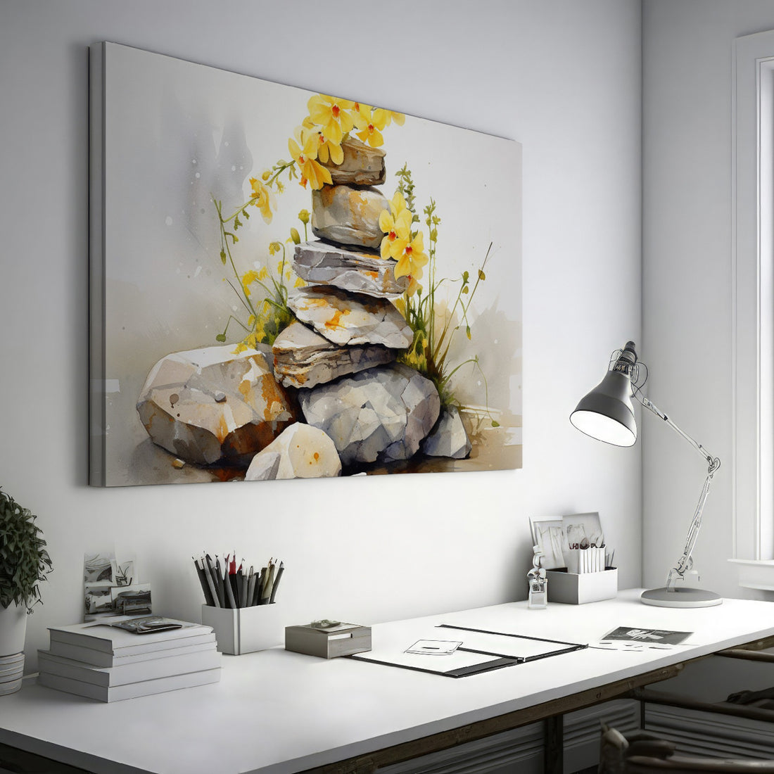 Framed canvas print of watercolour stones stacked with yellow flowers