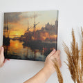 Framed canvas print of a sunset over a historic harbour with vintage ships