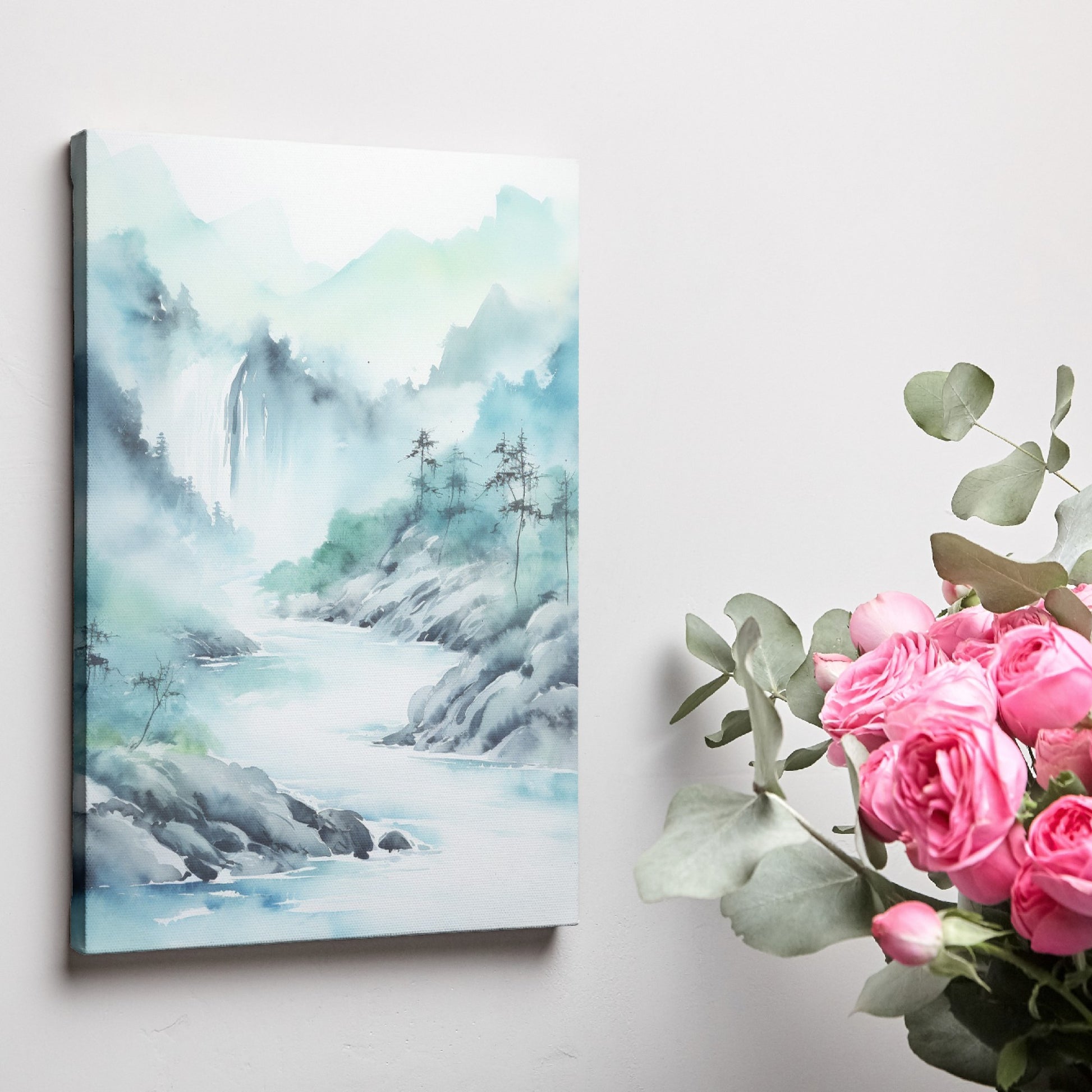 Framed canvas print of a tranquil watercolour painting depicting misty mountains and a serene river landscape in soft blue and green hues.