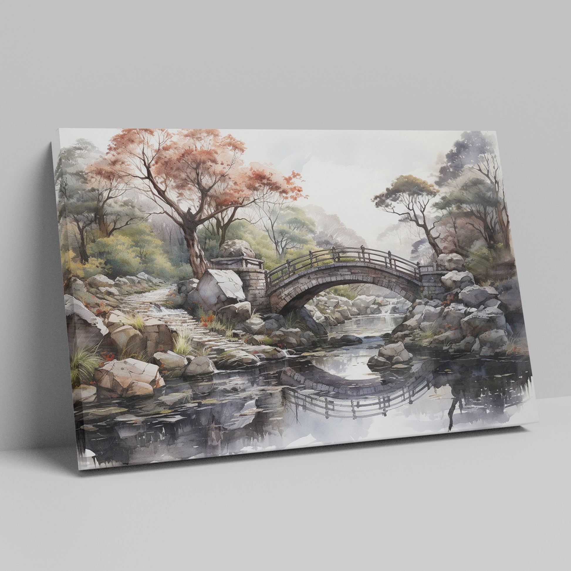 Framed canvas print of an autumnal stone bridge over a serene stream, surrounded by trees with watercolour details