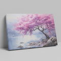 Framed canvas print of a cherry blossom tree by a lake with vivid pink flowers and tranquil blue waters