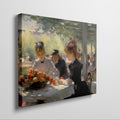 Framed canvas print of a 19th-century Impressionist dining scene with figures in elegant attire.