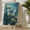 Framed canvas print of a vivid blue butterfly with delicate white flowers on a blue background