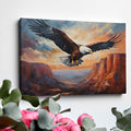 Framed canvas print of a majestic eagle soaring over a canyon at sunset