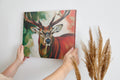 Framed canvas print of an impressionist stag portrait with vibrant red and green tones