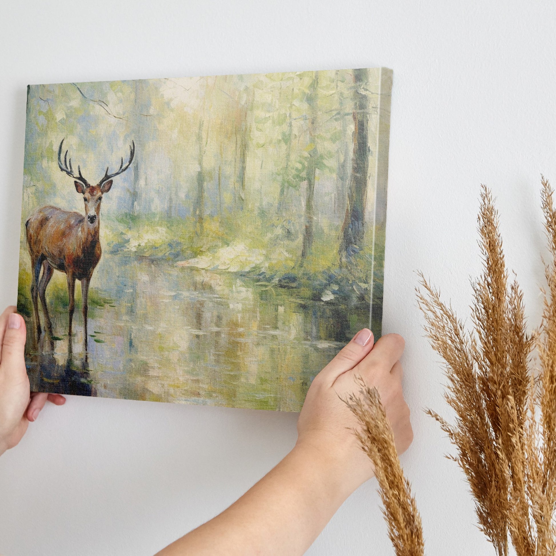 Framed canvas print of a deer standing beside a forest stream in impressionist style