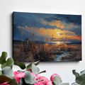 Framed canvas print of an impressionistic sunset over a coastal landscape with vibrant warm hues