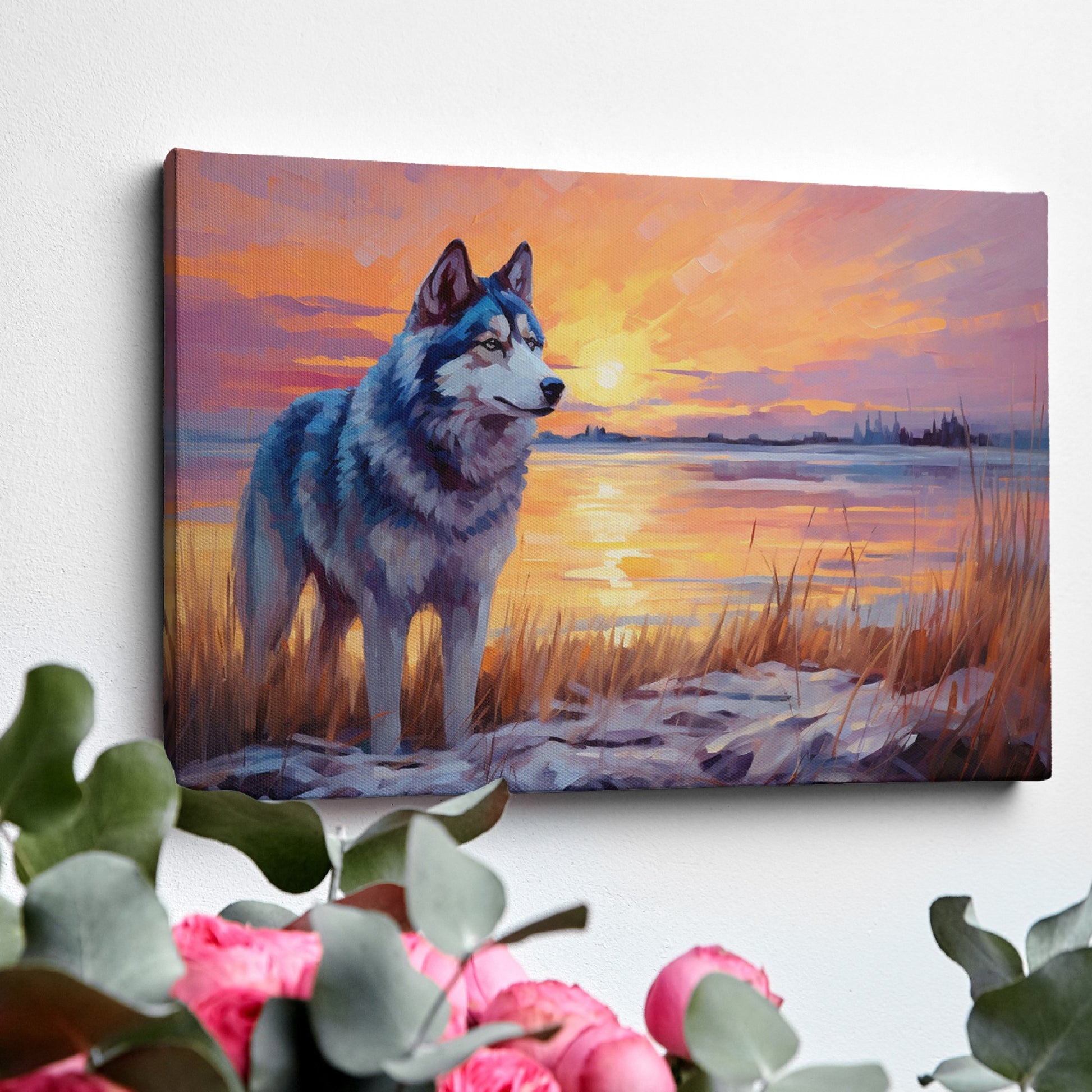 Framed canvas print of a Husky in silhouette against a colourful sunset with reflection on water