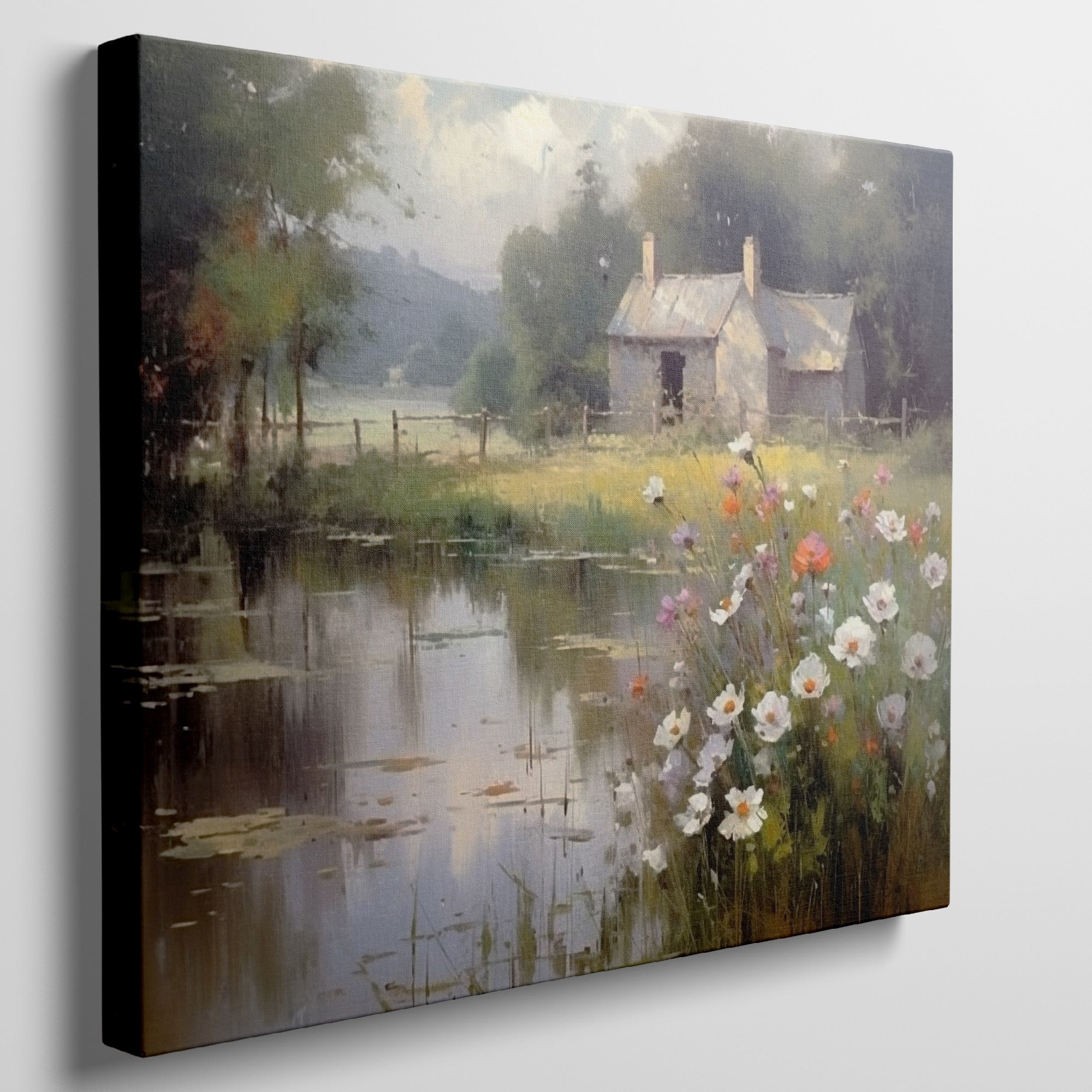 Framed canvas print of a rustic cottage by a peaceful lake with wildflowers in the foreground