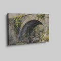 Framed canvas print of a rustic stone bridge with ivy in watercolour style