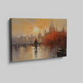 Framed canvas print of an impressionistic cityscape at sunset with reflections on a river