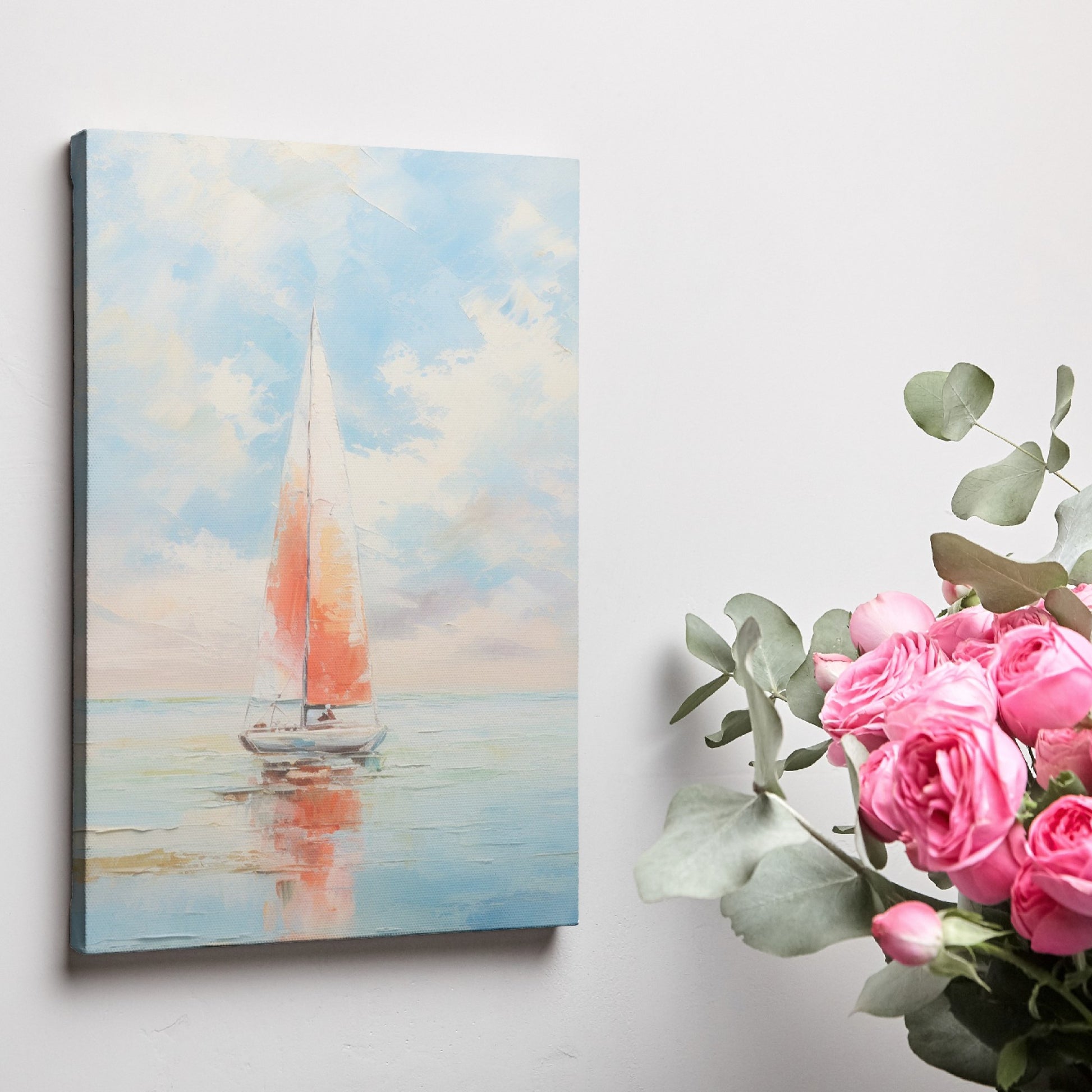 Framed canvas print of a vibrant sailboat against a pastel sunset sky reflected on tranquil ocean waters