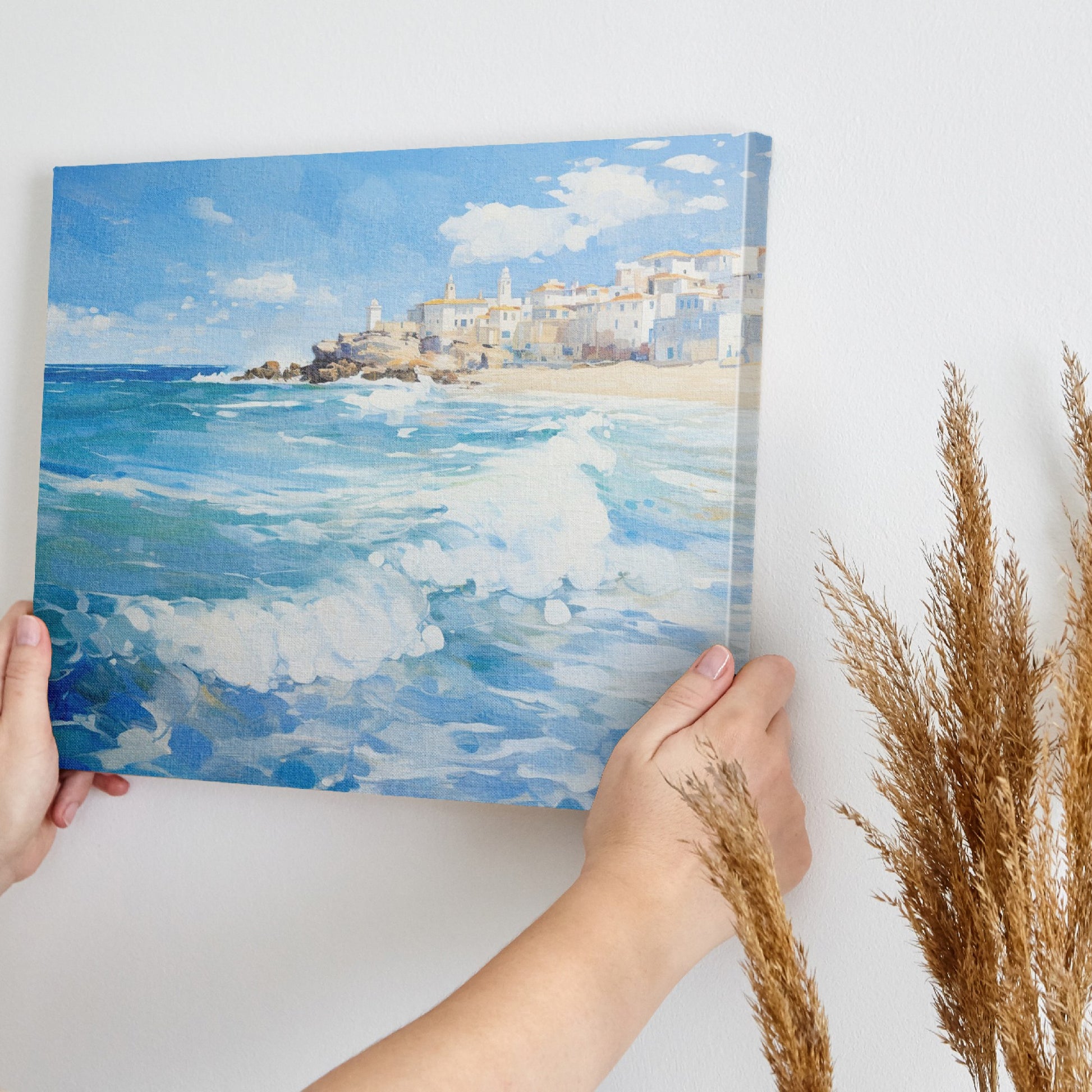 Framed canvas print of a Mediterranean village by the sea with vibrant blue waves and sunny sky