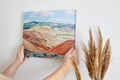 Framed canvas print of a serene and rustic painted hills landscape