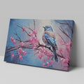 Framed canvas print of a bluebird perched on cherry blossom branches, with vibrant blue and pink hues