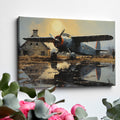 Framed canvas print of vintage airplane with warm sunset reflection on airfield