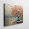 Framed canvas print of a textured autumnal tree with orange and gold foliage by a serene lake