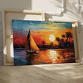 Framed canvas print of an Impressionist sailboat sailing at sunset with vibrant orange and blue colors