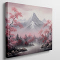 Framed canvas print of serene mountain landscape with pink cherry blossoms and mist