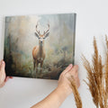 Framed canvas print of a majestic stag in a misty forest setting