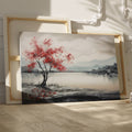 Framed canvas print of a serene landscape painting showcasing a vibrant red tree against a monochrome backdrop with flying birds