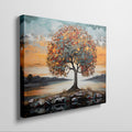 Textured canvas art of a tree with autumn leaves and a serene sunset in the background