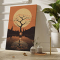 Framed canvas print of a silhouetted tree and candle with golden autumnal hues