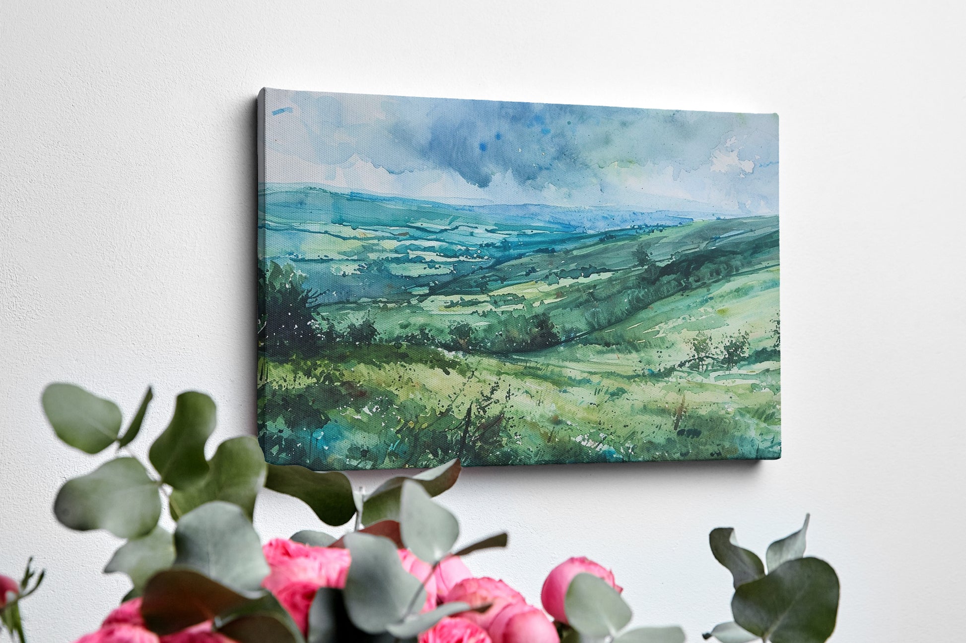 Framed canvas print of a watercolour countryside landscape with green rolling hills and vibrant skies