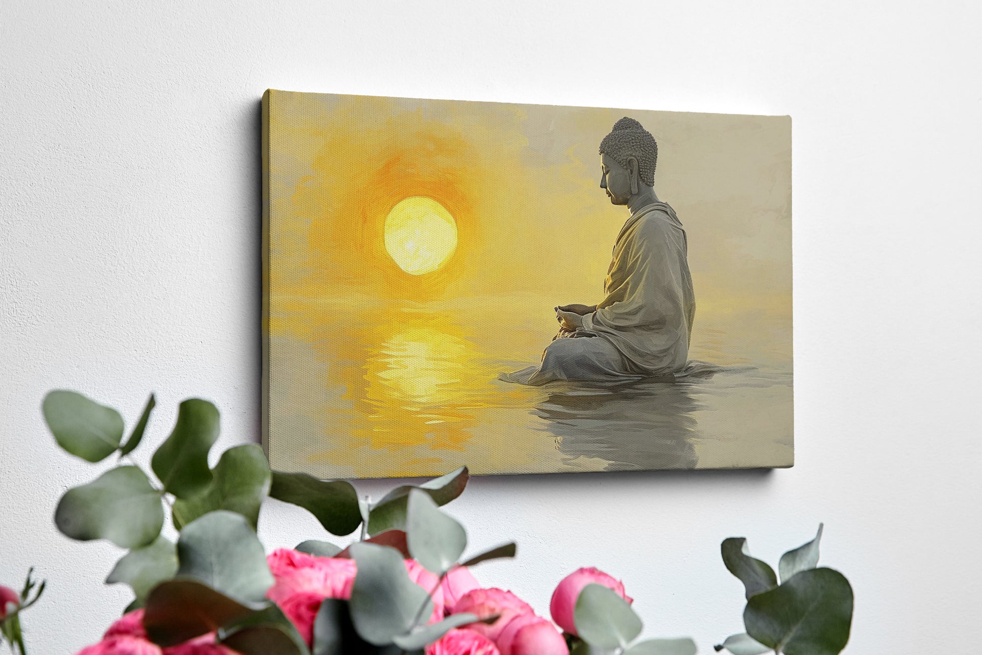 Framed canvas print of a meditative figure with the sun setting over water, reflecting golden tones