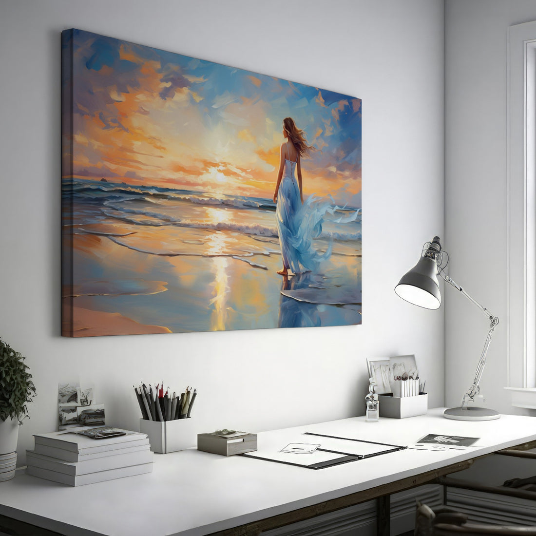 Framed canvas print of a woman in an elegant dress at sunset on a beach, with vibrant reflection in water