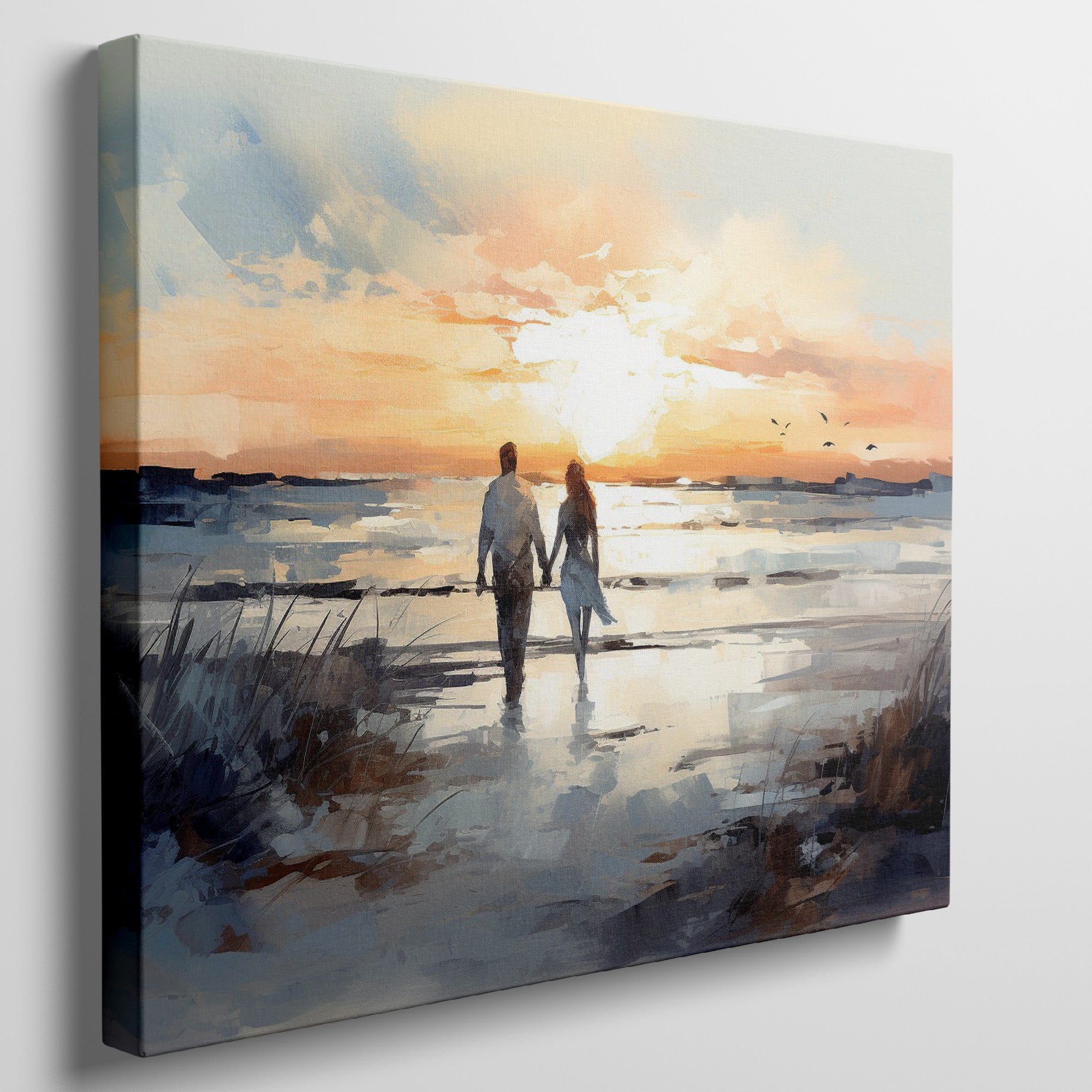 Framed canvas print of a couple walking on the beach at sunset with reflective water and warm colours