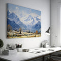 Framed canvas print of an impressionist painting featuring a snowy mountain landscape with an alpine village