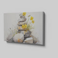 Framed canvas print of Zen stones balanced in watercolour with yellow flowers