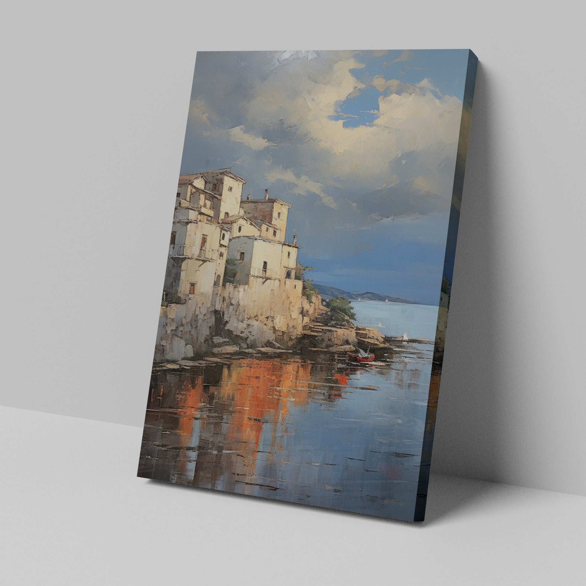 Framed canvas print of a Mediterranean coastal village during sunset with golden reflections on water