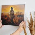 Framed canvas print of a figure in traditional attire at sunset with a savannah wildlife scene