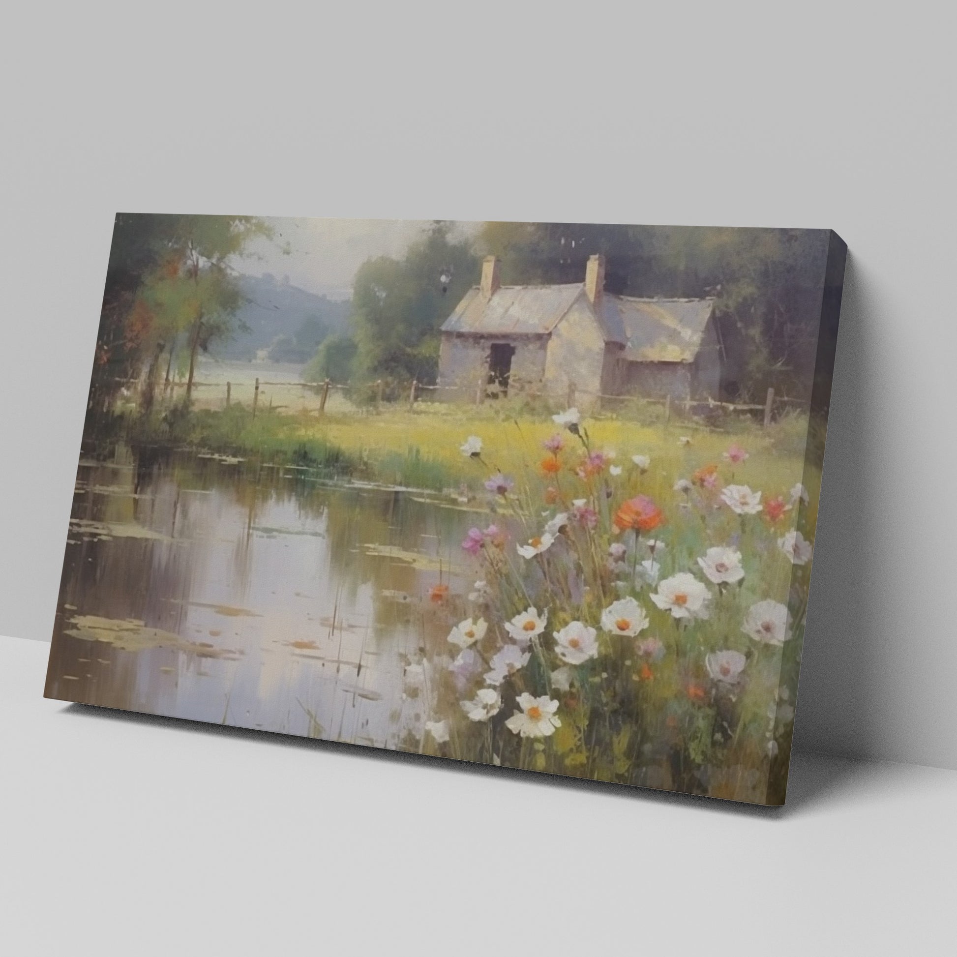 Framed canvas print of a rustic cottage by a peaceful lake with wildflowers in the foreground