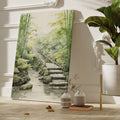 Framed canvas print of tranquil bamboo forest with arched bridge and stream in watercolour