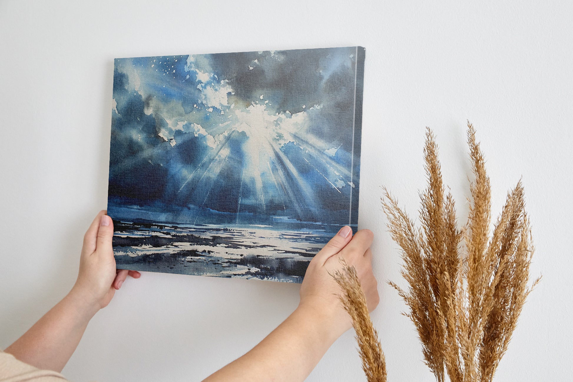 Watercolor canvas print of sunbeams shining through clouds onto the ocean