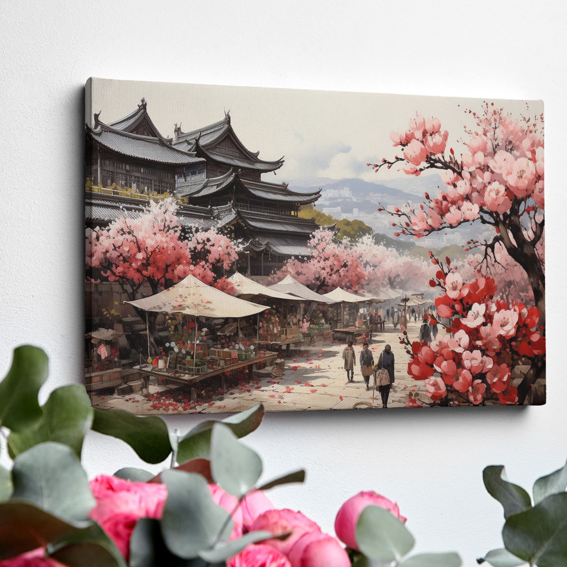 Framed canvas print of a traditional Japanese town during cherry blossom season with pink florals and historic architecture