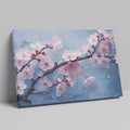 Framed canvas print of cherry blossoms with rain droplets on blue background