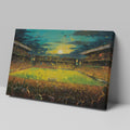 Framed canvas print of an impressionist painting capturing a football match at sunset with a cheering crowd