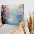 Framed canvas print of a serene landscape with cherry blossoms and a misty lake